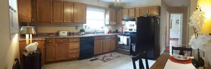 2412 Dugspur Road Callaway, VA 24067 - Photo 9 of 35 a kitchen with stainless steel appliances granite countertop a refrigerator and a stove