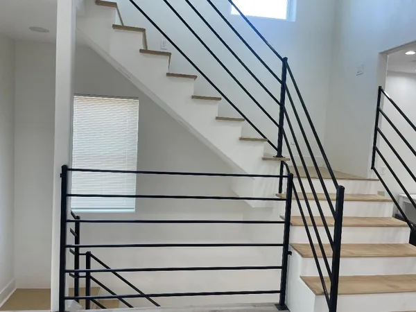 a view of a hallway view with staircase