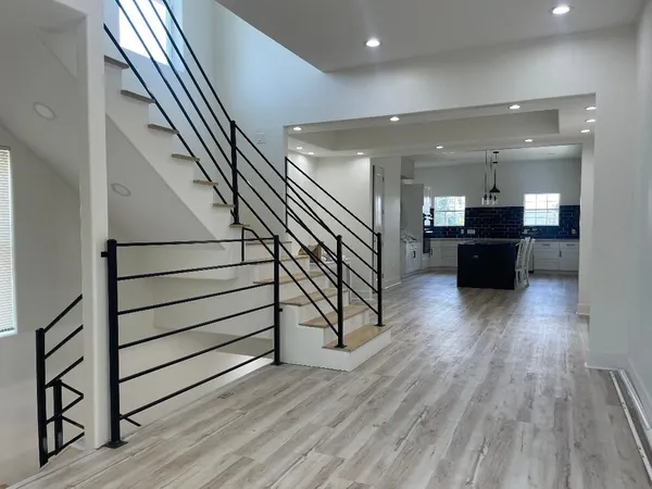 a bathroom with a sink double vanity granite and a mirror