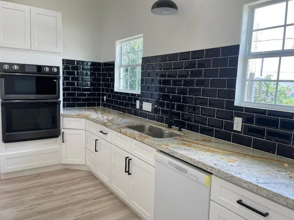 a kitchen with a sink and cabinets