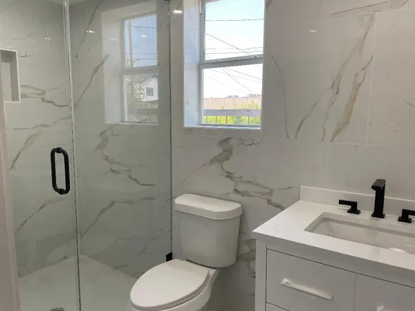 a bathroom with a bathtub and a toilet