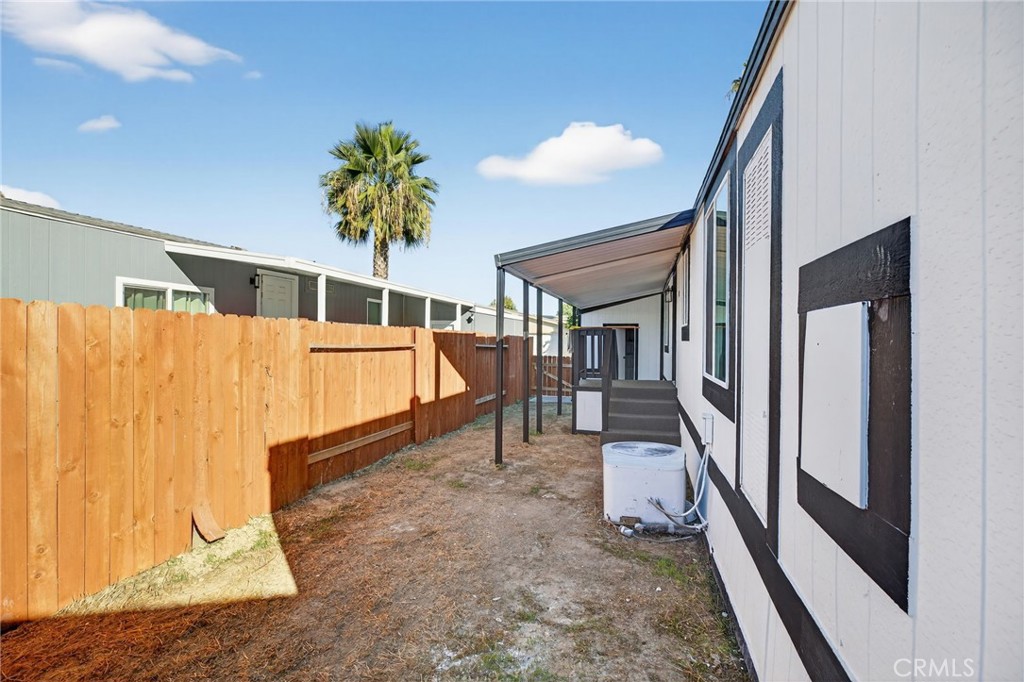 80 Dawes Street, Unit 88 Perris, CA 92571 - Photo 21 of 29 a porch with a table and chairs
