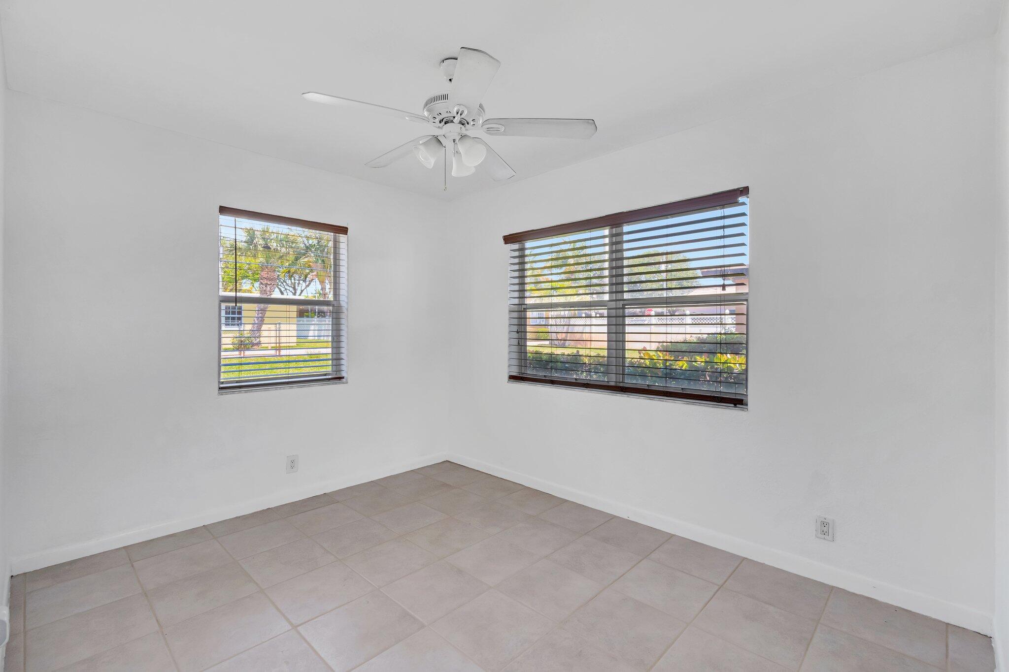 706 Southeast 4th Avenue, Unit 706 Delray Beach, FL 33483 - Photo 7 of 13 a view of an empty room with a window