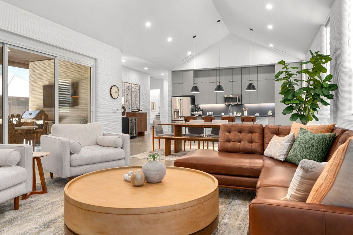 221 Lone Ranger Trail Georgetown, TX 78628 - Photo 14 of 35 a living room with furniture and a dining table with kitchen view
