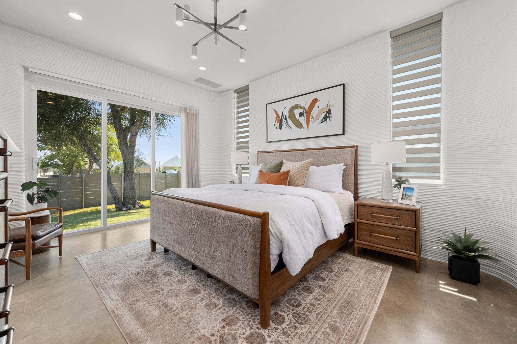 221 Lone Ranger Trail Georgetown, TX 78628 - Photo 15 of 35 a bedroom with a bed and a large window