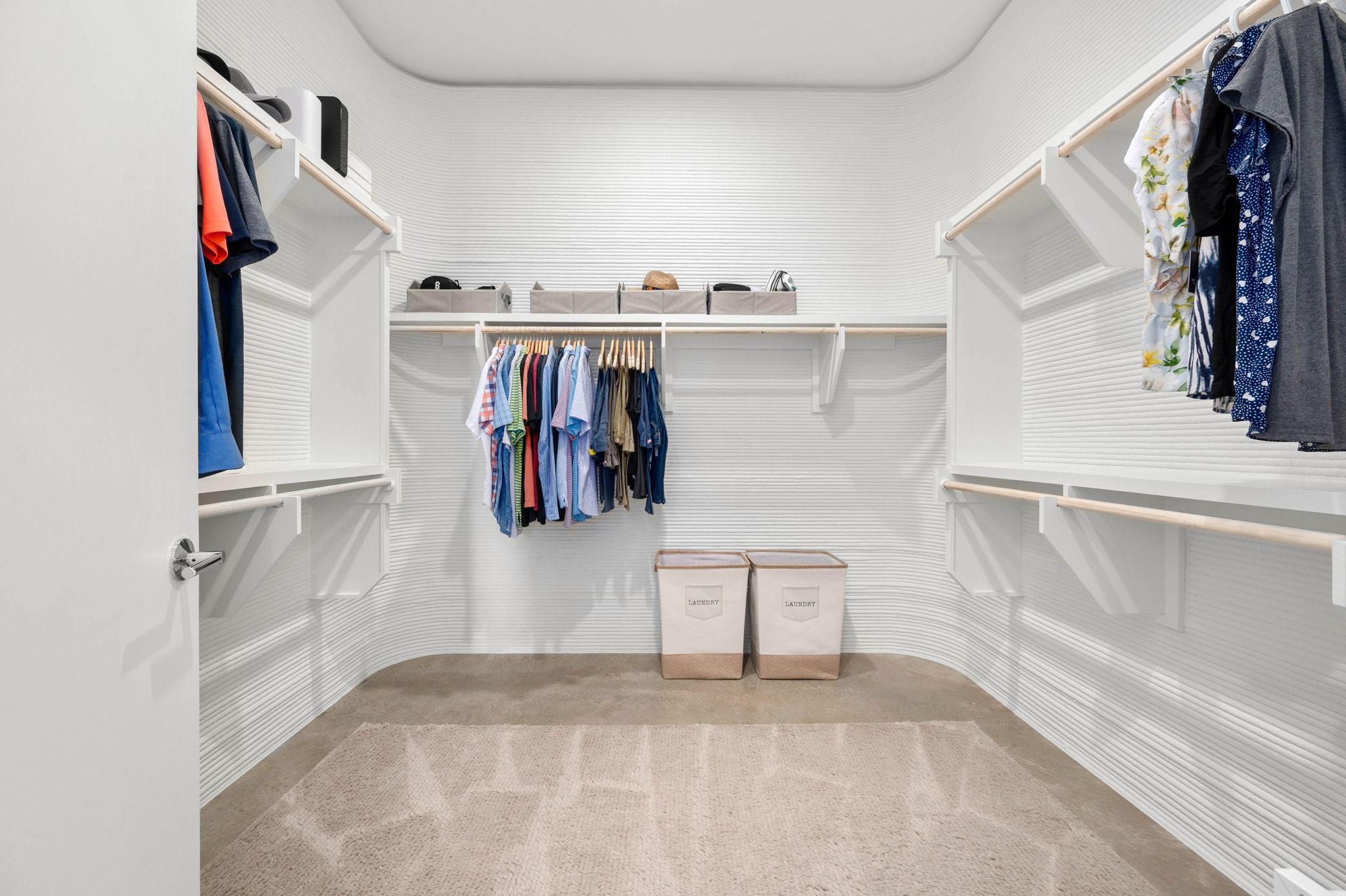 221 Lone Ranger Trail Georgetown, TX 78628 - Photo 17 of 35 a view of walk in closet with clothes and shoes