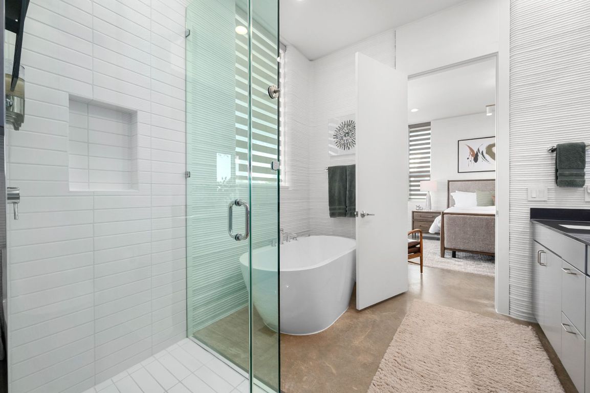 221 Lone Ranger Trail Georgetown, TX 78628 - Photo 18 of 35 a spacious bathroom with a bathtub and sink