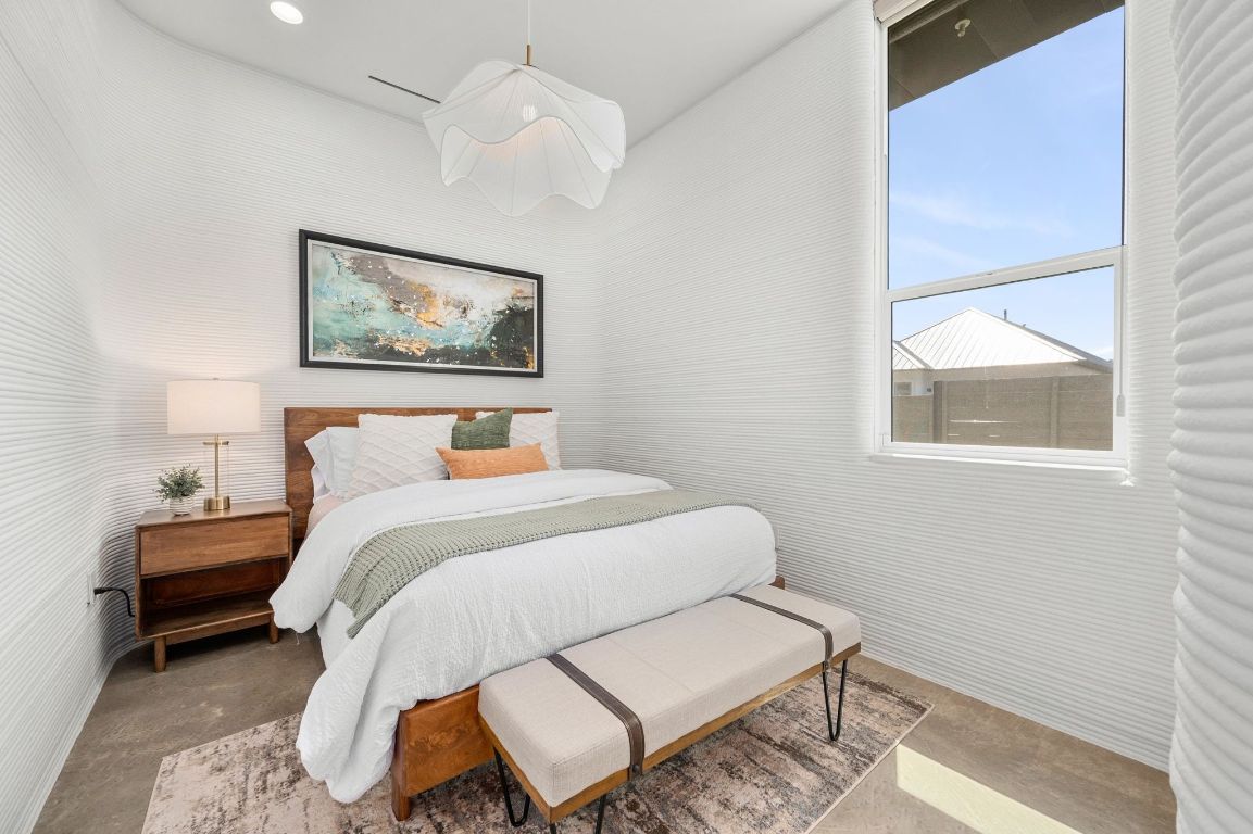 221 Lone Ranger Trail Georgetown, TX 78628 - Photo 20 of 35 a bedroom with a bed and a painting on the wall