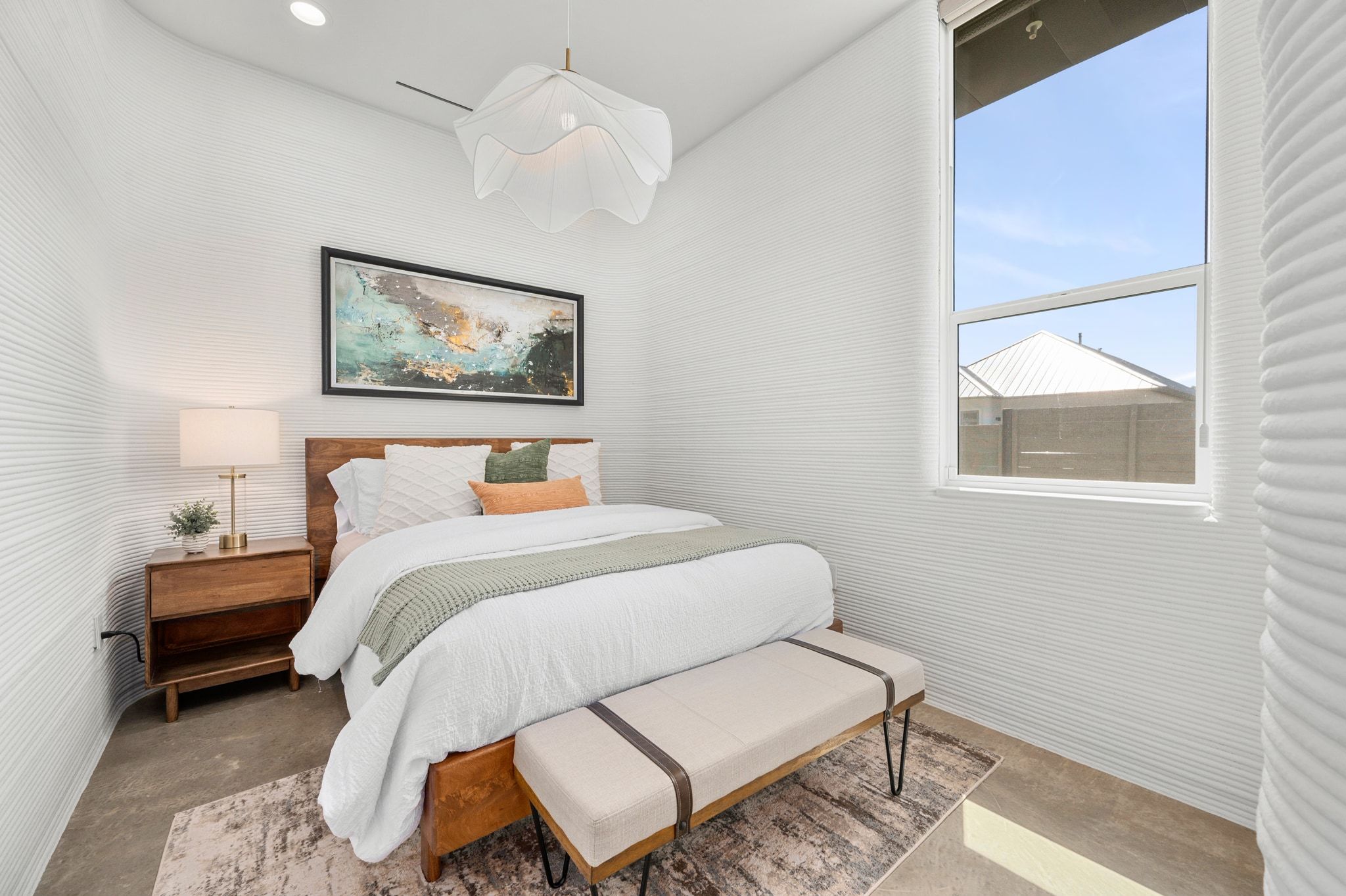 221 Lone Ranger Trail Georgetown, TX 78628 - Photo 20 of 35 a bedroom with a bed and a painting on the wall