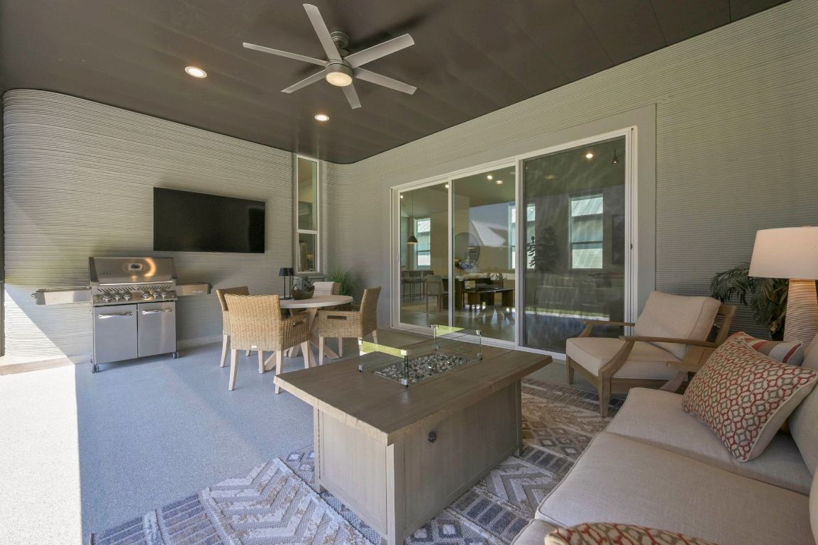 221 Lone Ranger Trail Georgetown, TX 78628 - Photo 24 of 35 a living room with furniture and a flat screen tv