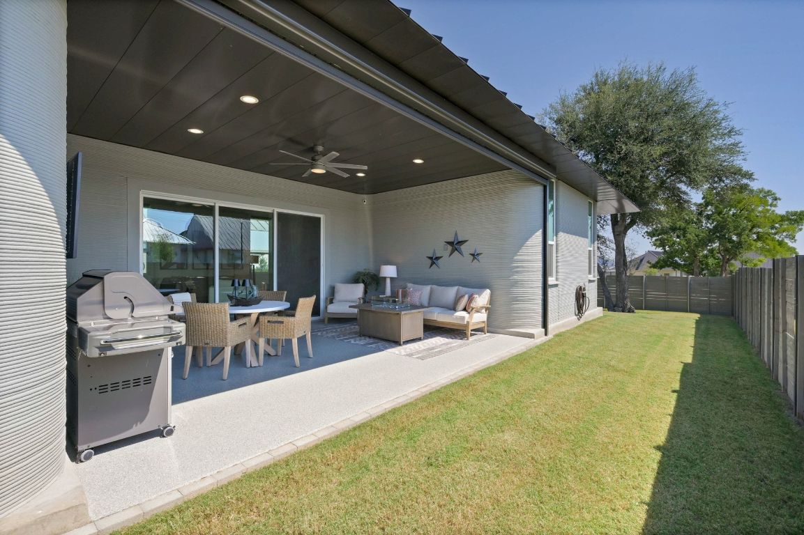 221 Lone Ranger Trail Georgetown, TX 78628 - Photo 25 of 35 a living room with furniture a window and a table