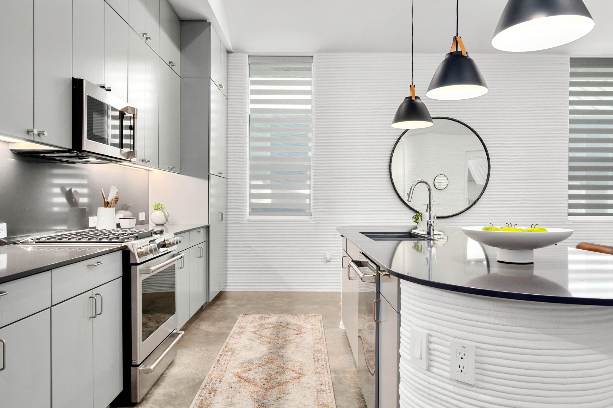 221 Lone Ranger Trail Georgetown, TX 78628 - Photo 7 of 35 a kitchen with a stove a sink a window and cabinets