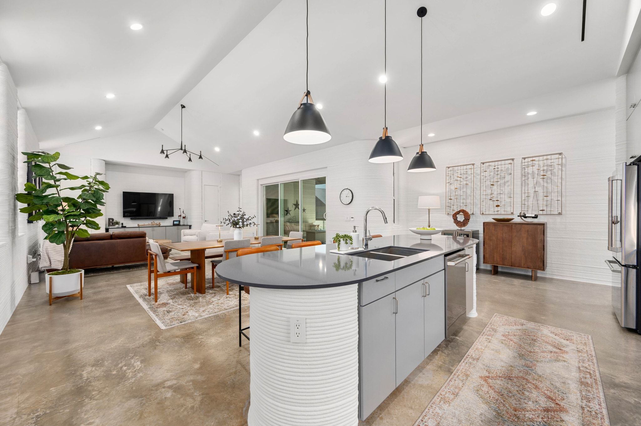 221 Lone Ranger Trail Georgetown, TX 78628 - Photo 8 of 35 a kitchen with sink stove and living room view