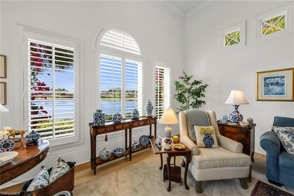 2629 Sorrel Way Naples, FL 34105 - Photo 20 of 43 a living room with furniture and a large window
