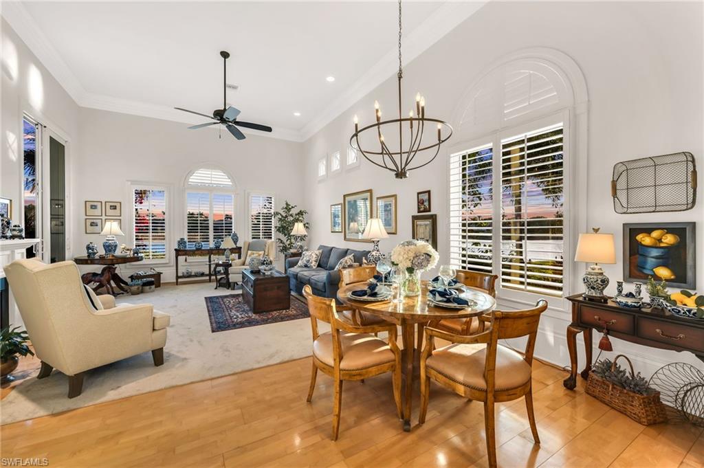 2629 Sorrel Way Naples, FL 34105 - Photo 23 of 43 a view of a dining room with furniture window and wooden floor