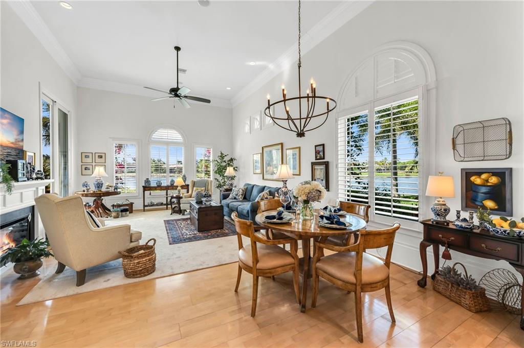 2629 Sorrel Way Naples, FL 34105 - Photo 26 of 43 a living room with lots of furniture and a chandelier