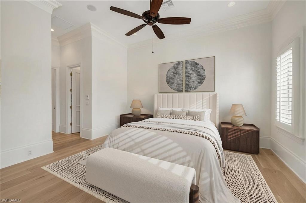 2629 Sorrel Way Naples, FL 34105 - Photo 27 of 43 a bedroom with a bed ceiling fan and a window