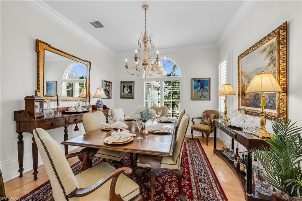 2629 Sorrel Way Naples, FL 34105 - Photo 30 of 43 a view of a dining room with furniture window and wooden floor