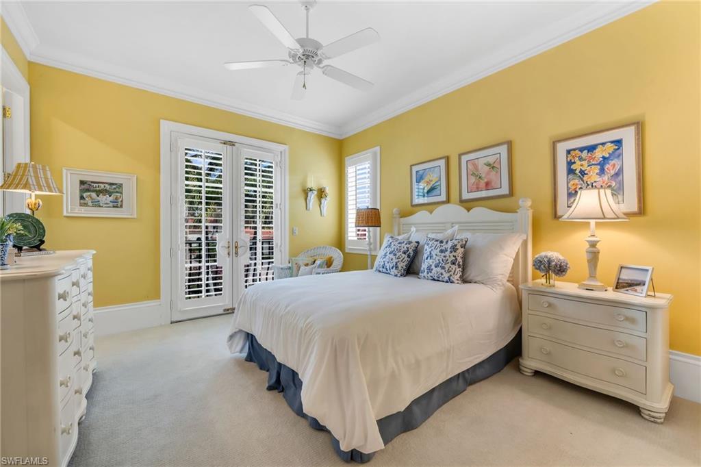 2629 Sorrel Way Naples, FL 34105 - Photo 33 of 43 a spacious bedroom with a bed and a window