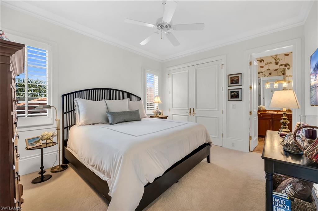 2629 Sorrel Way Naples, FL 34105 - Photo 35 of 43 a bedroom with a bed and wooden floor