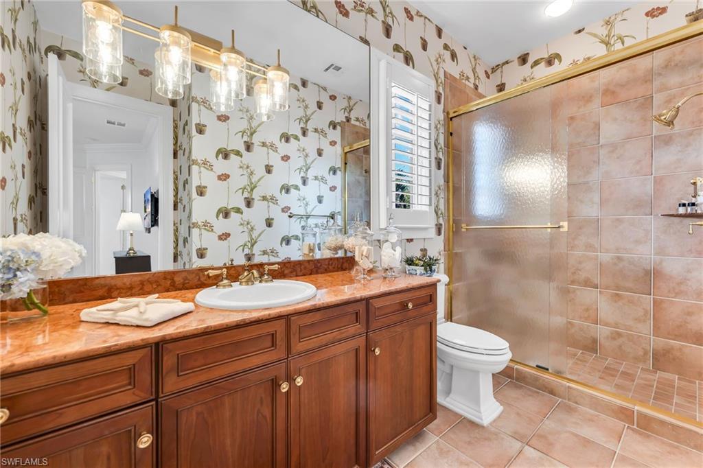 2629 Sorrel Way Naples, FL 34105 - Photo 36 of 43 a bathroom with a sink a toilet and shower