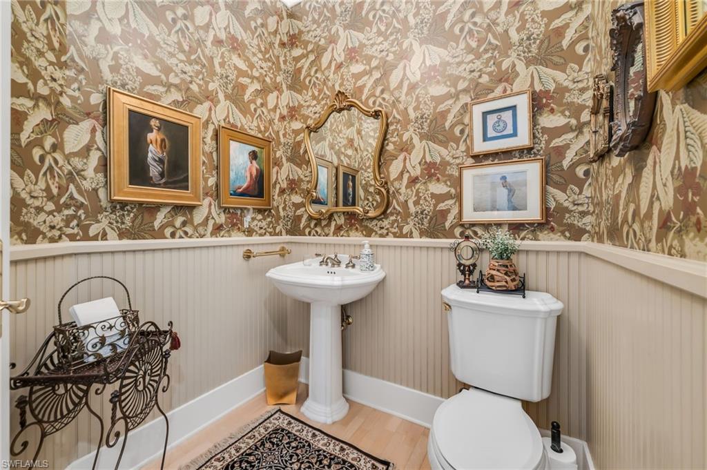 2629 Sorrel Way Naples, FL 34105 - Photo 38 of 43 a bathroom with a sink toilet and mirror