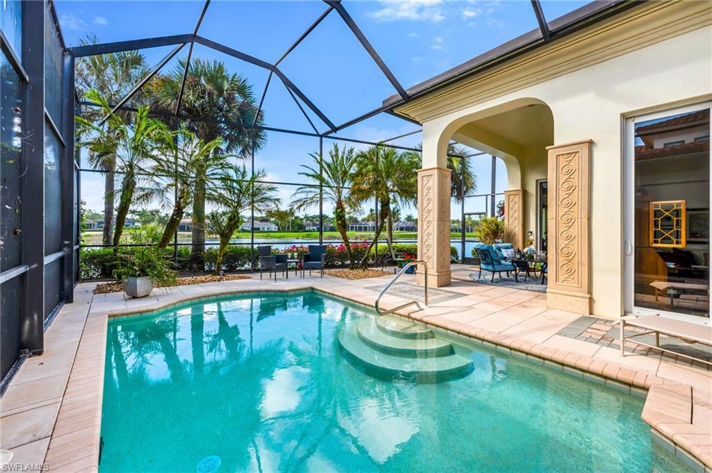 2629 Sorrel Way Naples, FL 34105 - Photo 7 of 43 a view of a swimming pool with a patio