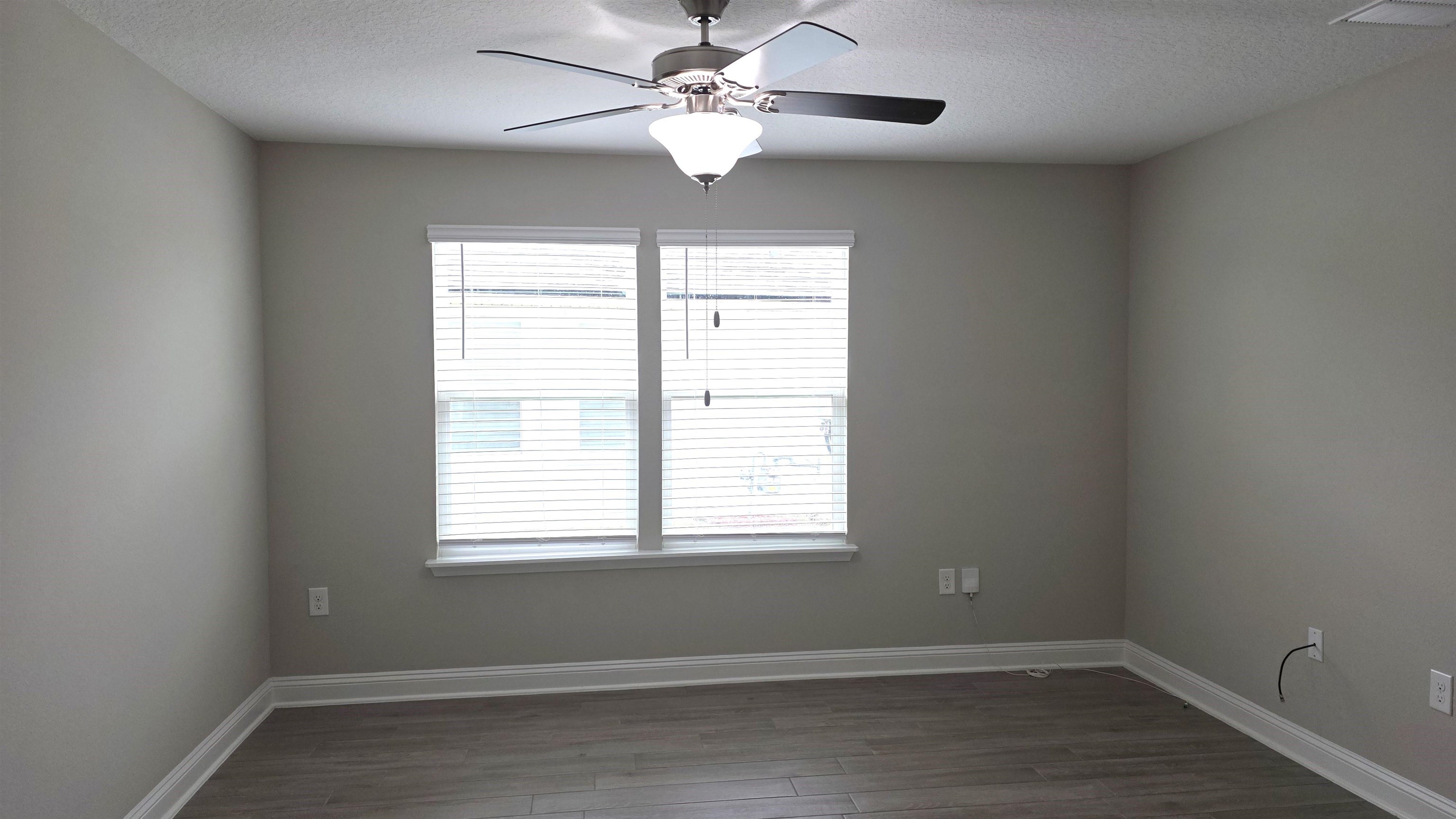 721 Navarez Street St. Augustine, FL 32084 - Photo 13 of 34 wooden floor in an empty room with a window