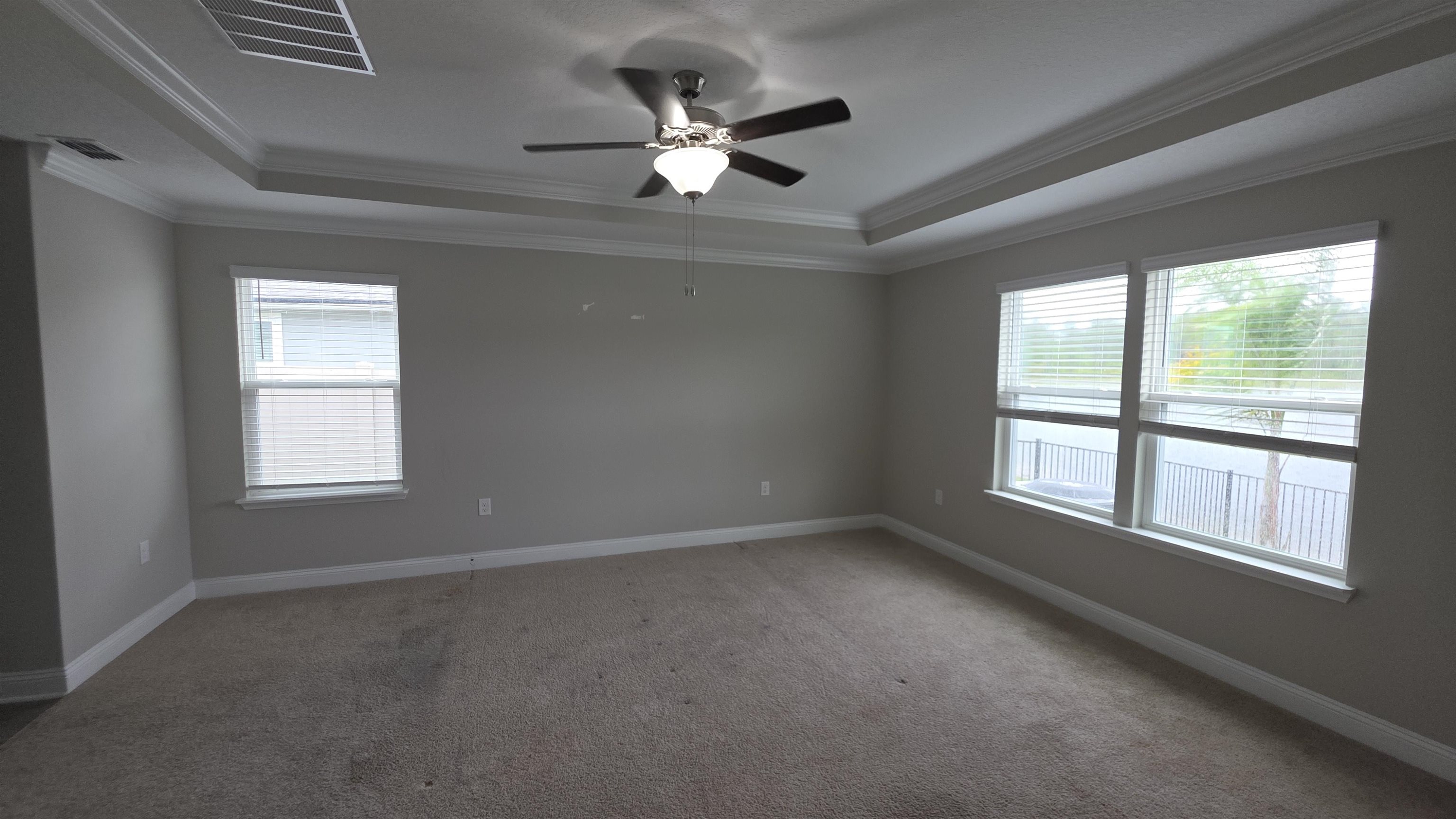 721 Navarez Street St. Augustine, FL 32084 - Photo 17 of 34 an empty room with ceiling fan and windows