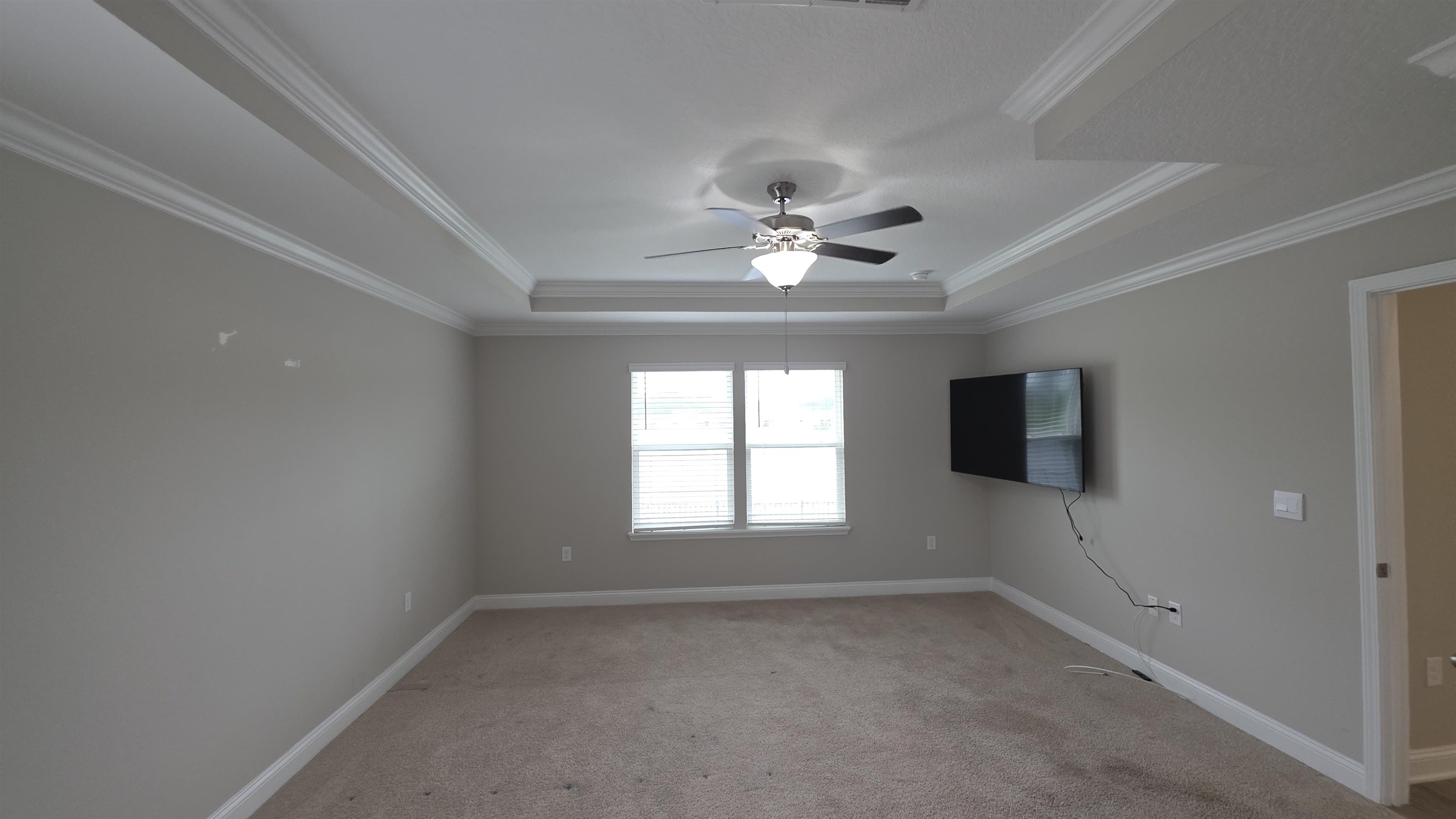 721 Navarez Street St. Augustine, FL 32084 - Photo 18 of 34 an empty room with a window and a fan