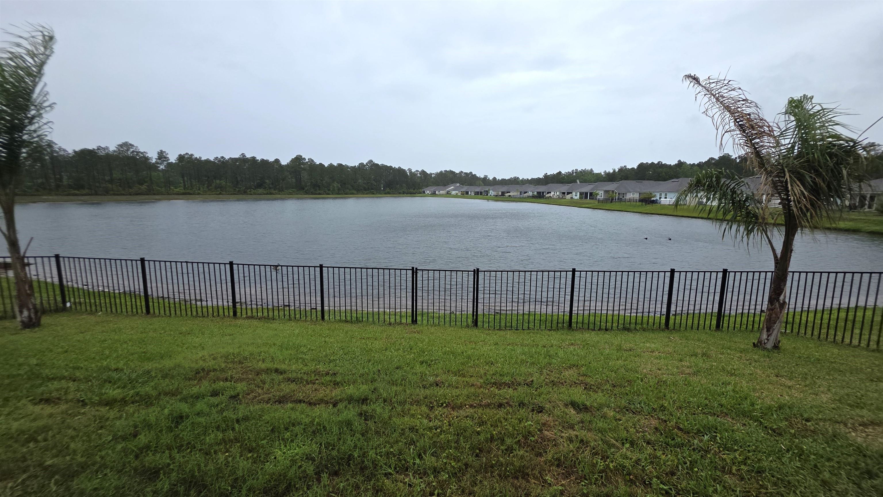 721 Navarez Street St. Augustine, FL 32084 - Photo 21 of 34 a view of a lake with houses in the back