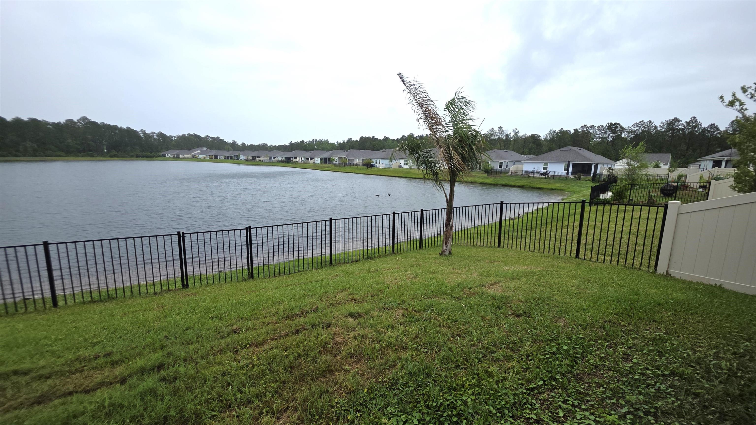 721 Navarez Street St. Augustine, FL 32084 - Photo 22 of 34 a view of a garden with houses in back