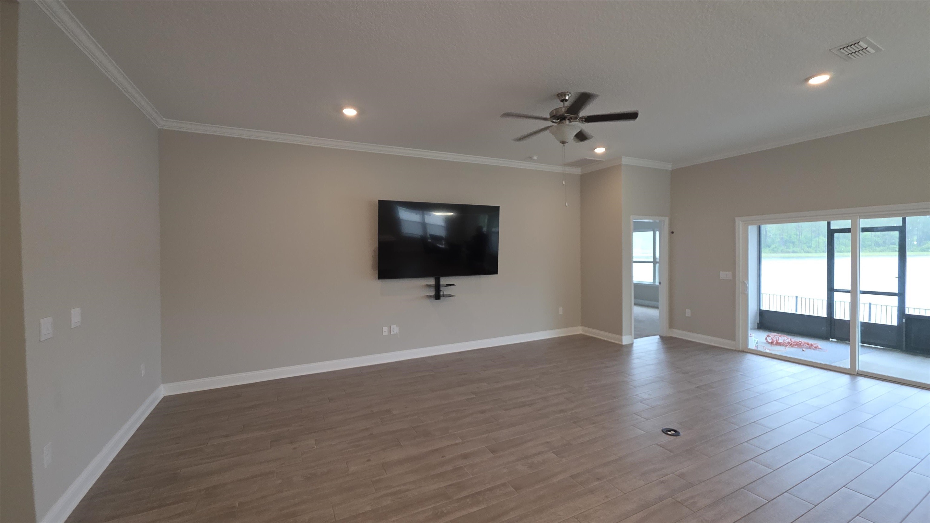 721 Navarez Street St. Augustine, FL 32084 - Photo 5 of 34 wooden floor in an empty room with a window