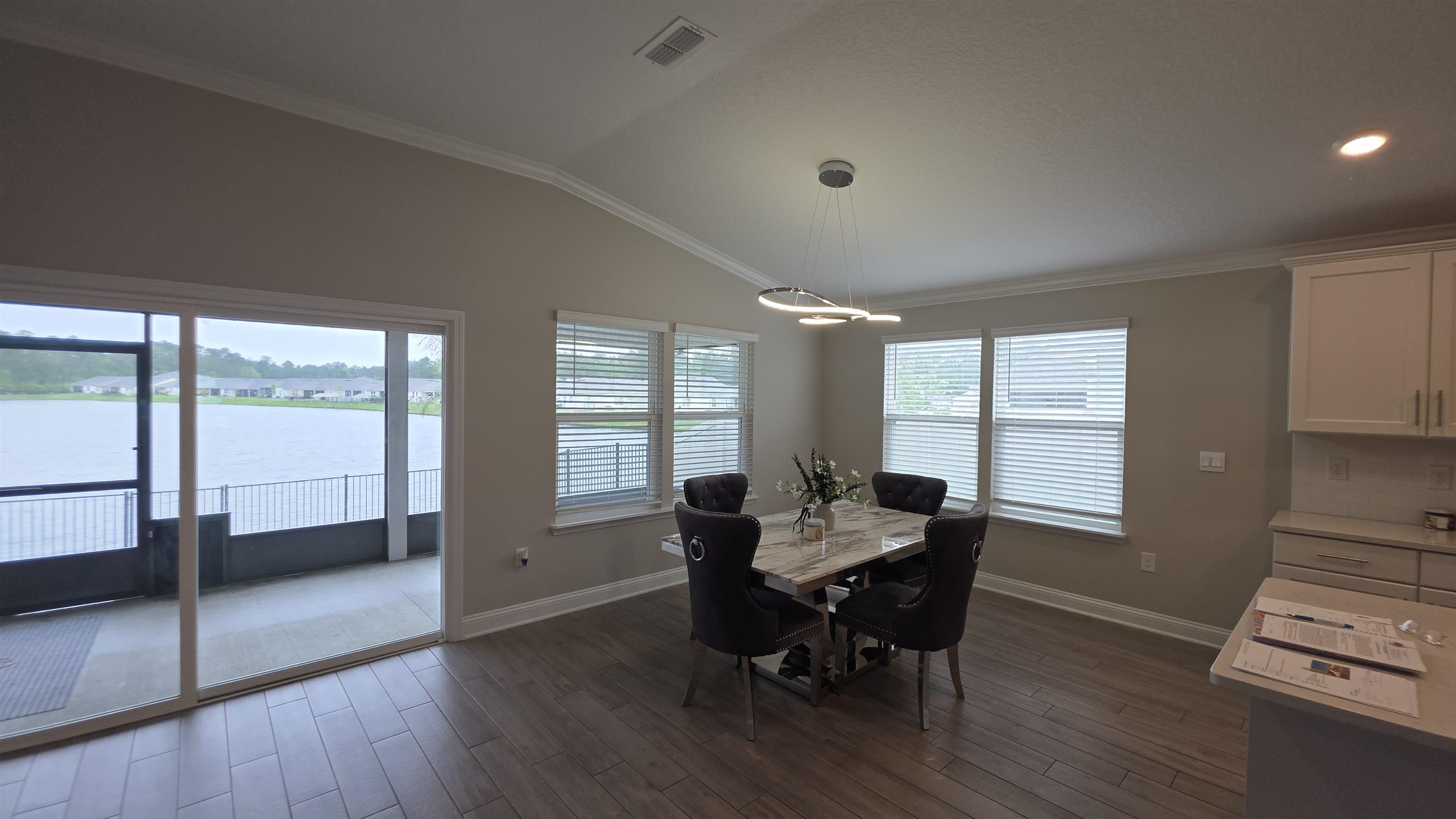 721 Navarez Street St. Augustine, FL 32084 - Photo 8 of 34 a dining room with furniture and wooden floor