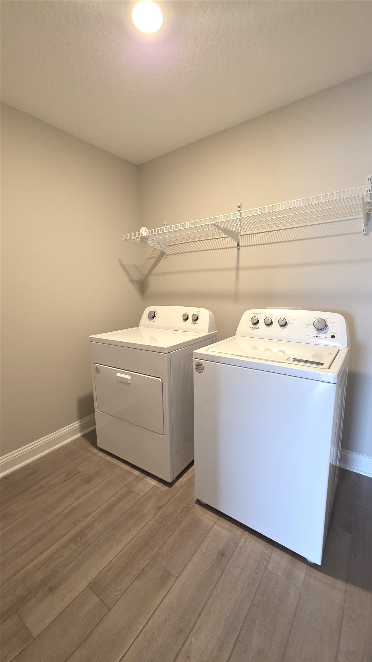 721 Navarez Street St. Augustine, FL 32084 - Photo 9 of 34 a utility room with dryer and washer