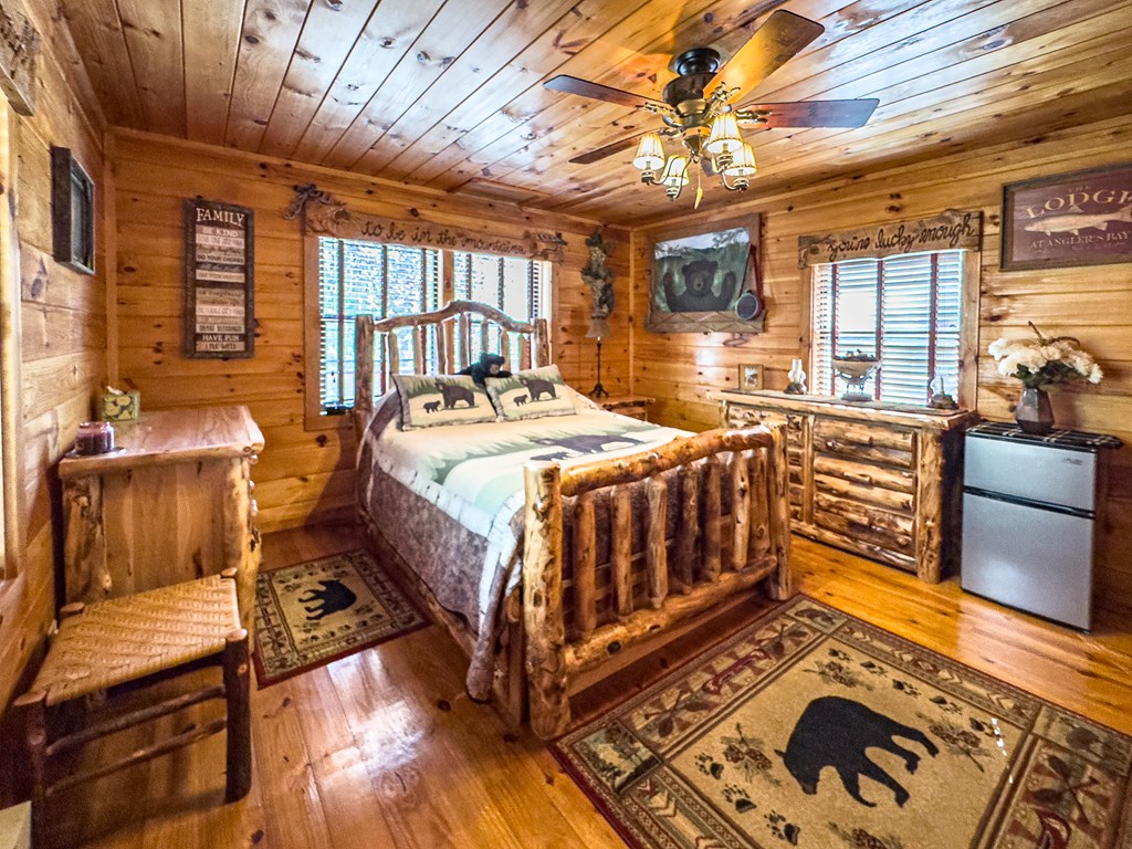614 Rockridge Road Murphy, NC 28906 - Photo 35 of 43 a bedroom with a bed and wooden floor