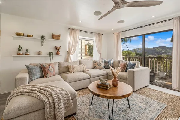 a living room with furniture and a large window