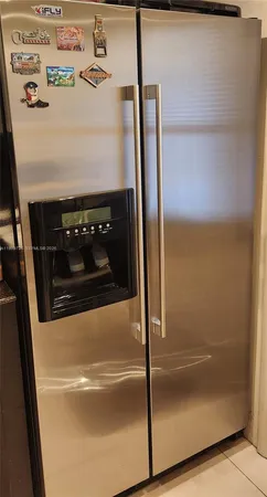 a bedroom with a bed and a lamp