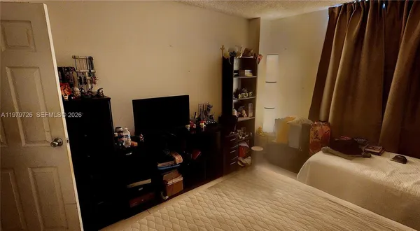 a bedroom with a bed and a walk in closet