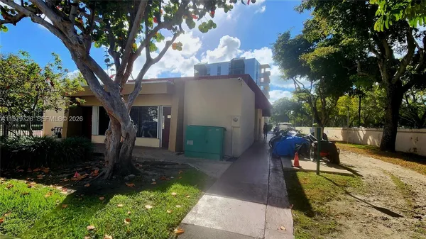a view of a street with a building in the background