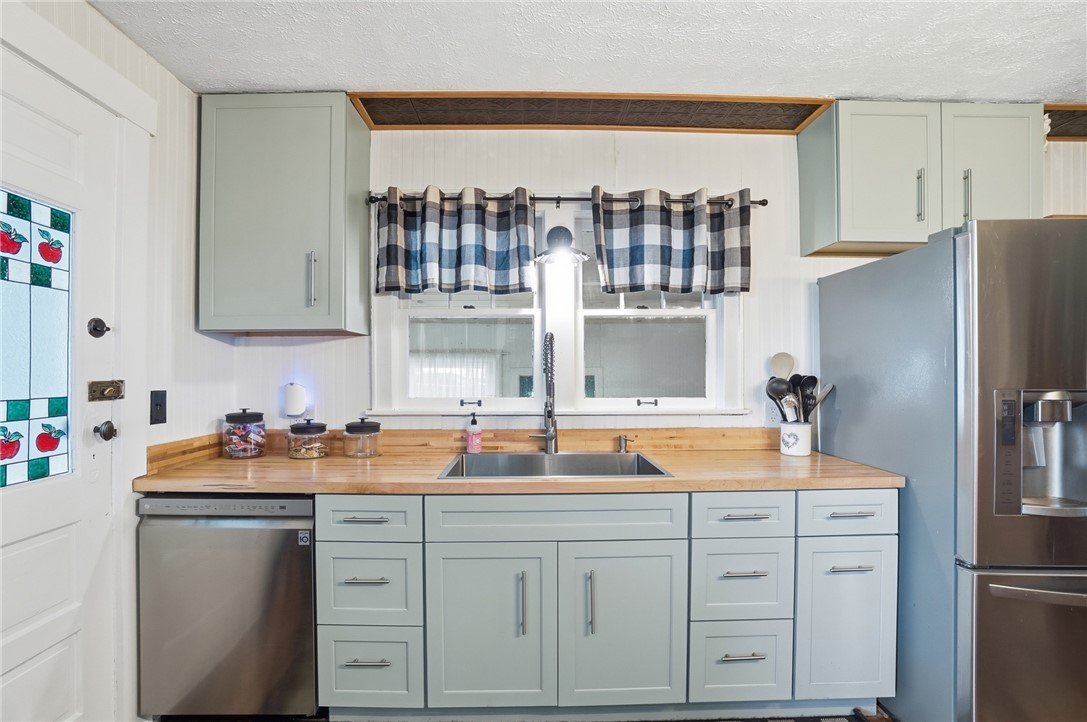 6155 North Union Road Clayton, OH 45315 - Photo 16 of 59 This charming kitchen features elegant cabinetry and abundant natural light, perfect for culinary endeavors.