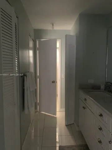 a bathroom with a shower and a sink