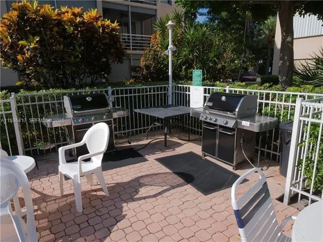 a view of a chairs and tables in the patio