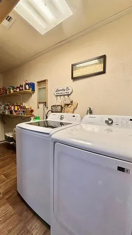 a room with two sink and a washer dryer
