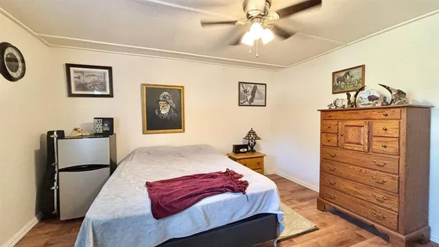 a living room with furniture and a dresser