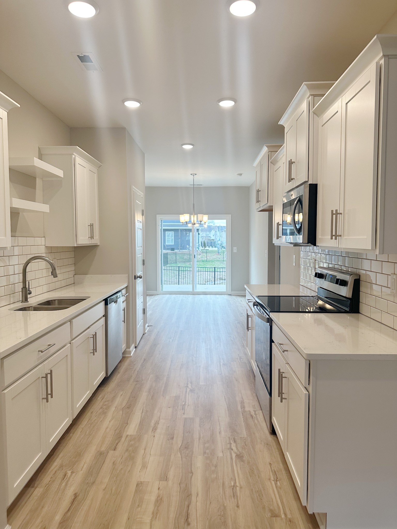 302 Carver Connection Lebanon, TN 37087 - Photo 25 of 43 a large kitchen with stainless steel appliances granite countertop a lot of counter space and wooden floors