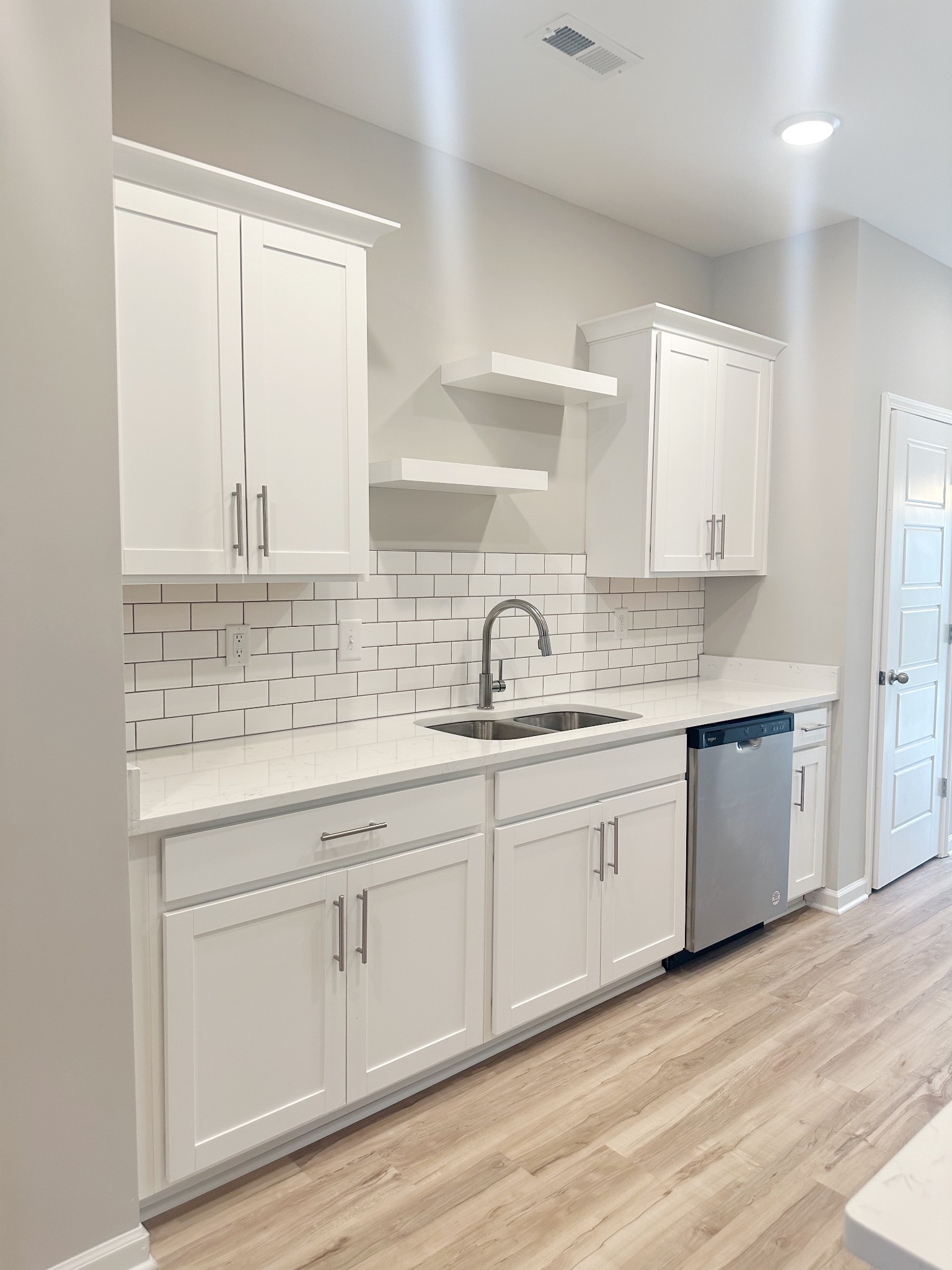 302 Carver Connection Lebanon, TN 37087 - Photo 26 of 43 a kitchen with sink cabinets and wooden floor