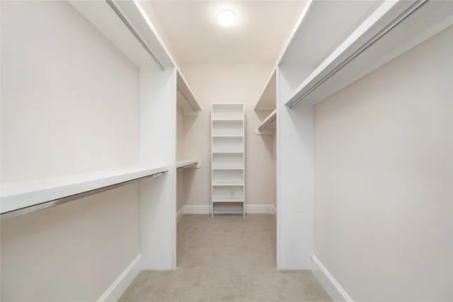 a view of an empty walk in closet