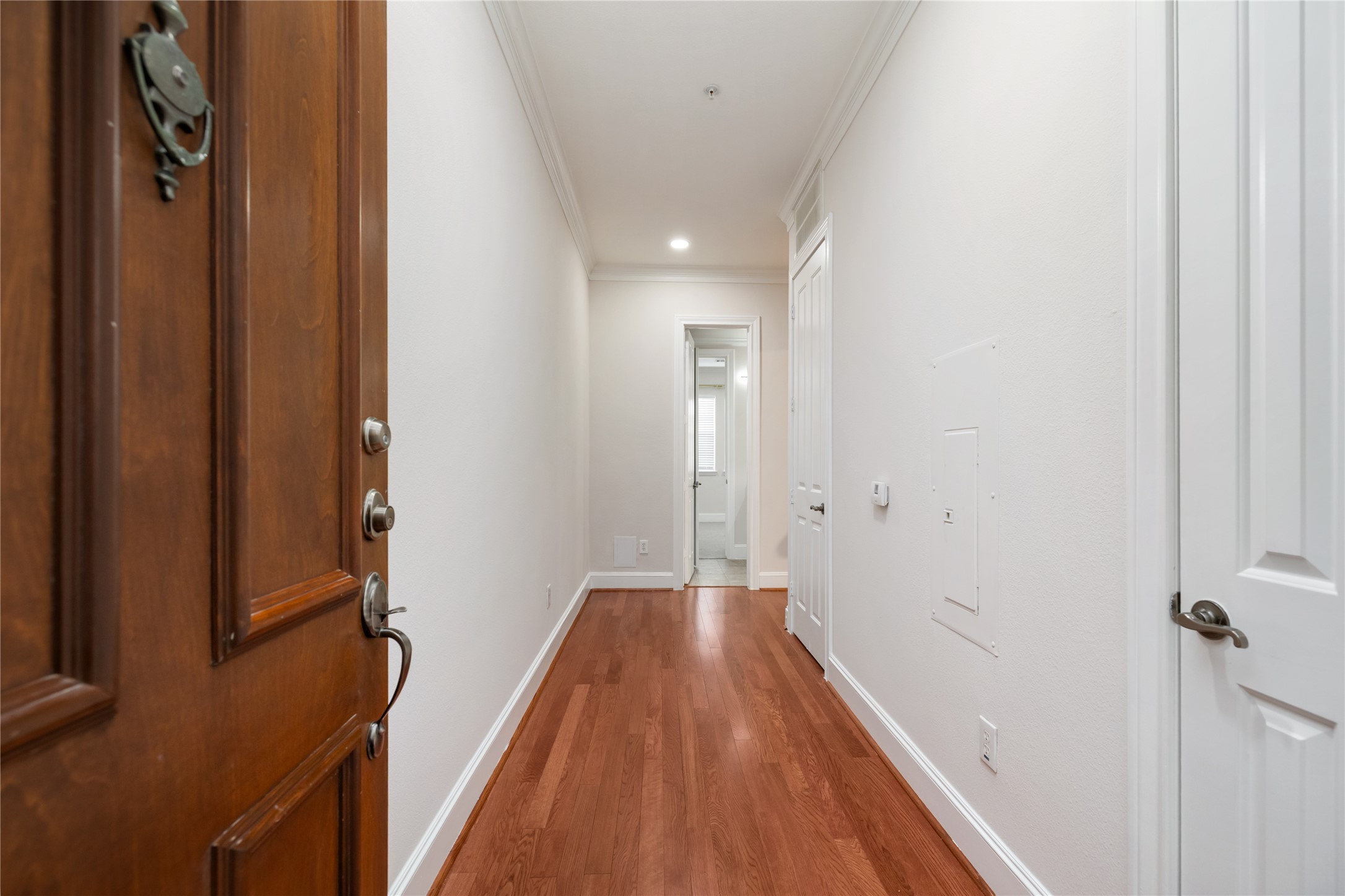 7134 Mapleridge Street, Unit 3G Houston, TX 77081 - Photo 2 of 26 a view of a bathroom from the hallway