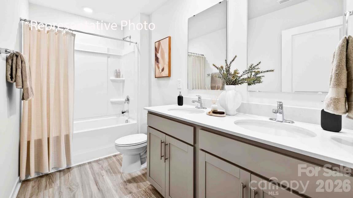 552 North Sparkleberry Street Chester, SC 29706 - Photo 26 of 28 a bathroom with a granite countertop sink toilet and shower